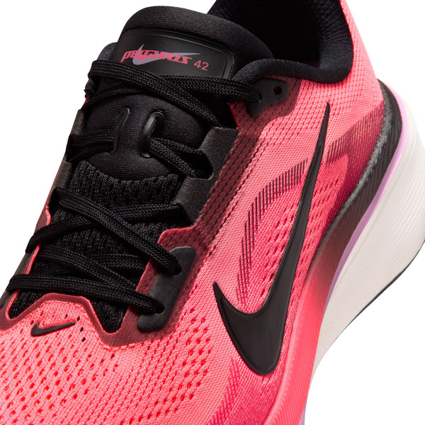 Pink running shoe with black laces and Nike logo on a white background