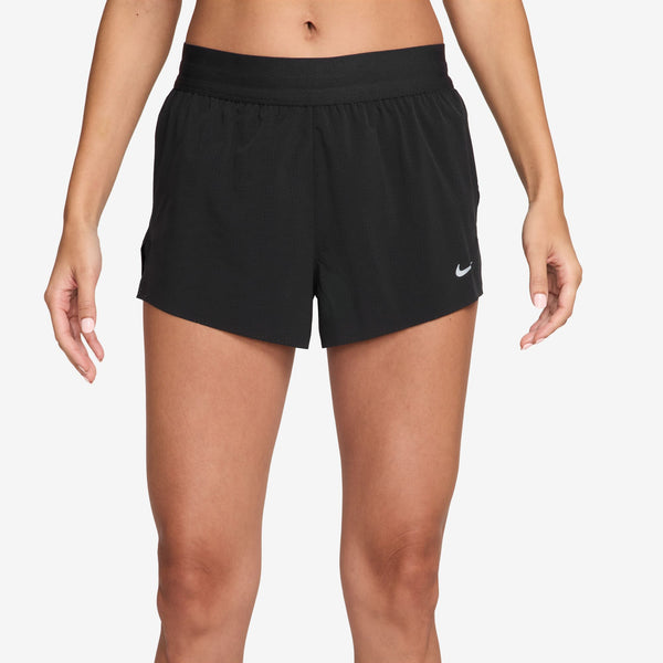 Black Nike shorts worn by a person on a white background