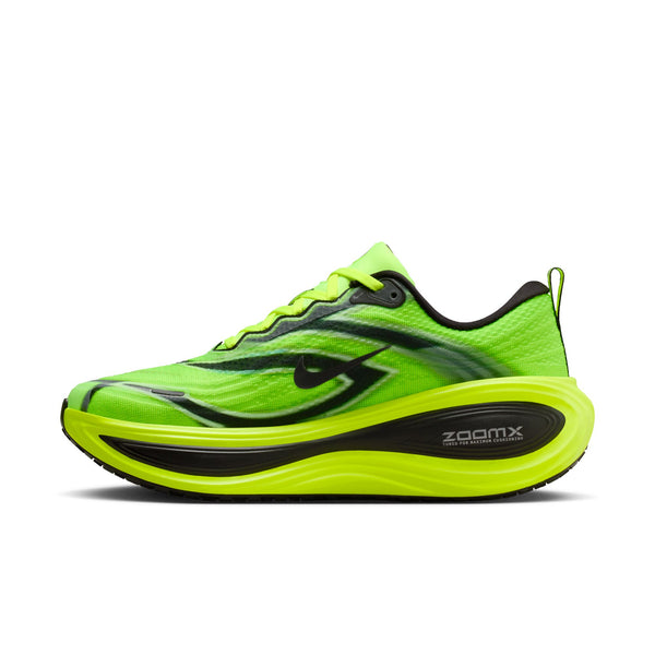 The medial side of this Nike shoe is bright green with black accents on a white background.