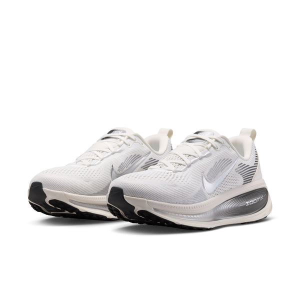 White running shoes with black soles on a white background
