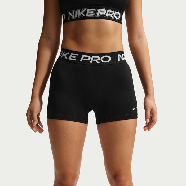 Black Nike Pro shorts and sports bra on a plain background