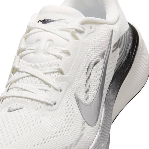 White running shoe with black swoosh logo on a white background