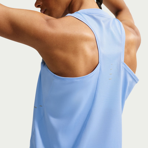 Close-up back view of a person wearing a light blue sleeveless athletic tank top against a plain light background.
