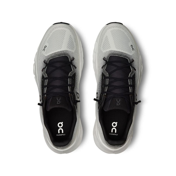 Pair of gray running shoes with black soles on a white background.