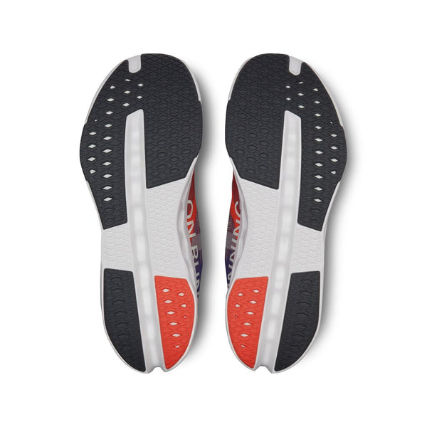 Pair of shoe insoles with black, white, and red design on a white background.