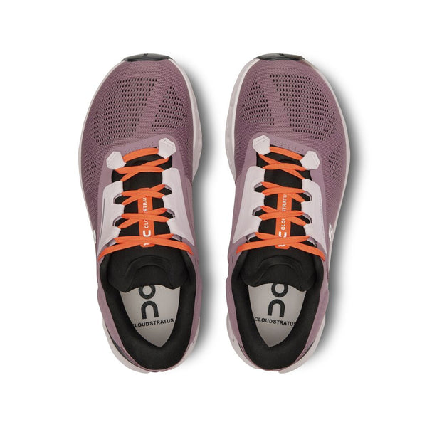 The laces on this On running shoe are orange and the upper is a mauve colorway.