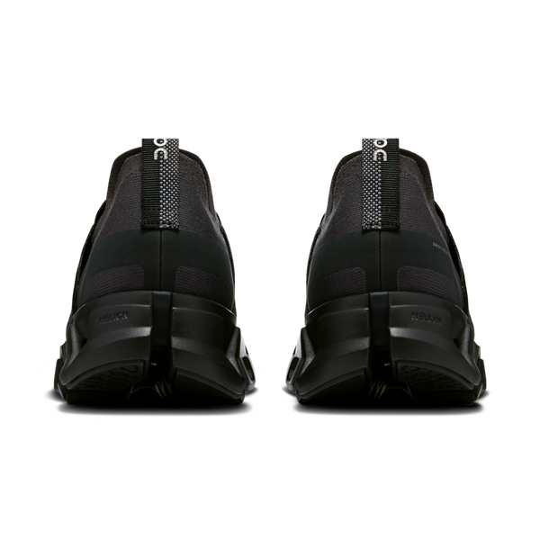 The heel tab on these men's shoes if half black and half black with white dots.