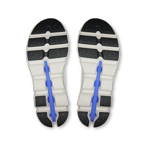 Top view of a pair of shoes with a blue arch support on a white background