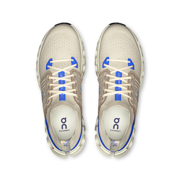 These On running shoes have cobalt blue highlights on the tongue as well as near the forefoot.