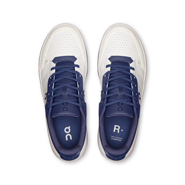 White and blue athletic shoes with visible branding on a white background.