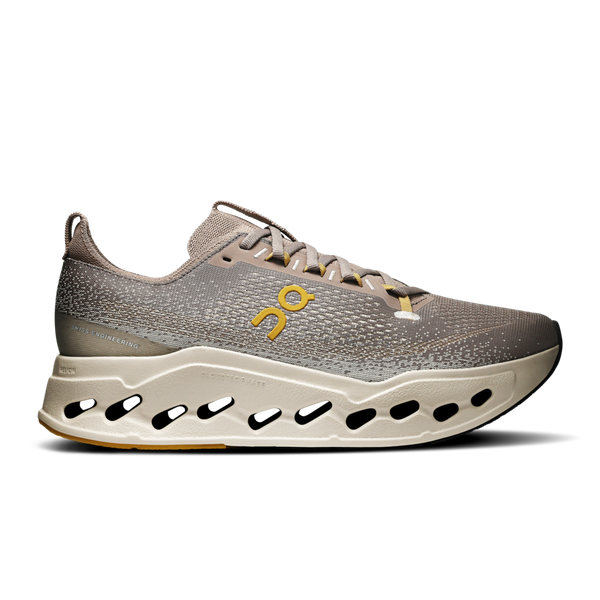 Gray rmen's On unning shoe with a yellow logo on a white background.
