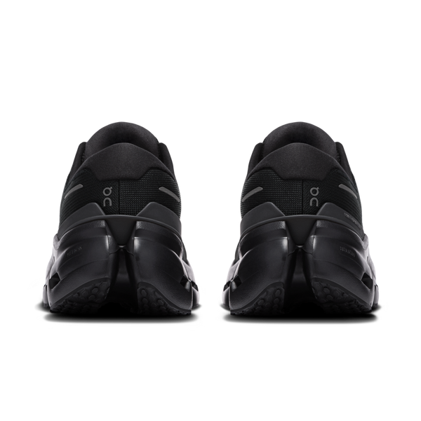 Black athletic shoes with 'On' branding on a white background