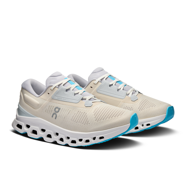 A pair of On running shoes with a white midsole adn light blue outsole.