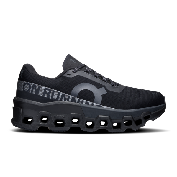 A pair of black On running shoes with the brand's logo visible on the side.