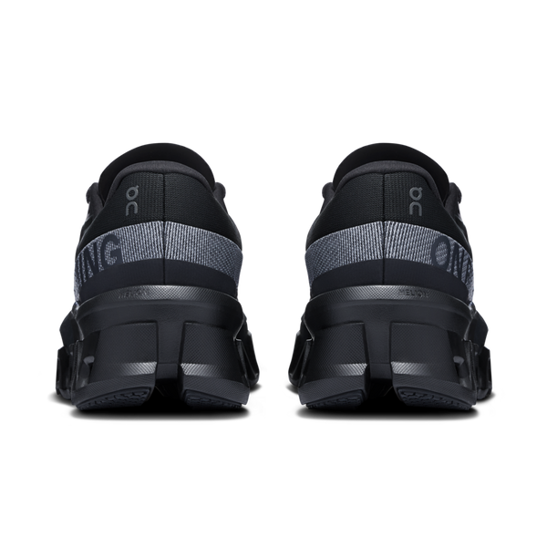 A reflective material in black wraps around the heel of this shoe.