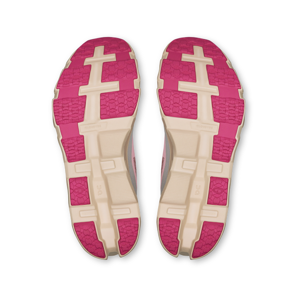 A pair of pink and beige shoe insoles on a white background.