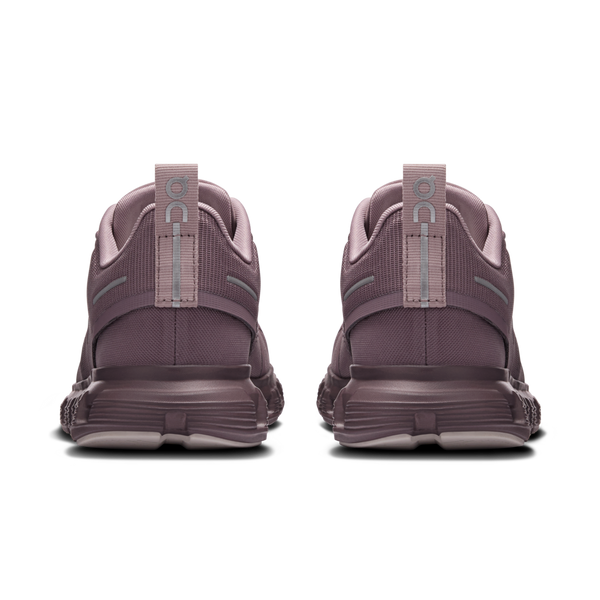 Pair of purple running shoes with visible brand logo on a white background
