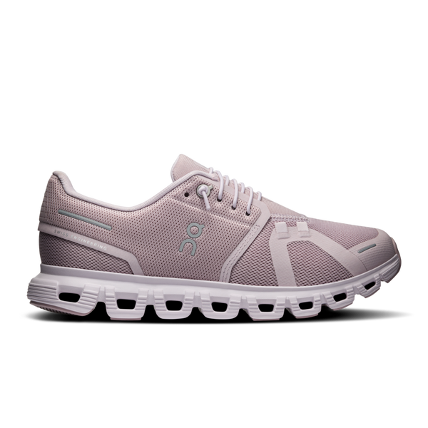 A pair of women's athletic shoes in gray color with a mesh upper and a white sole.