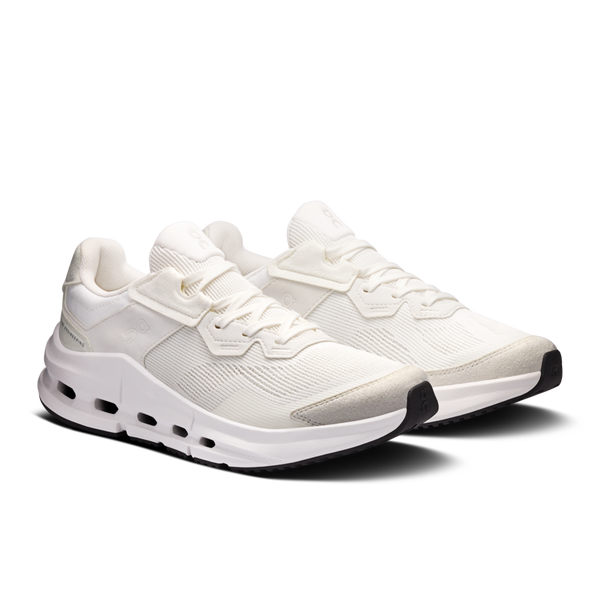 White running shoes with unique sole design on a transparent background