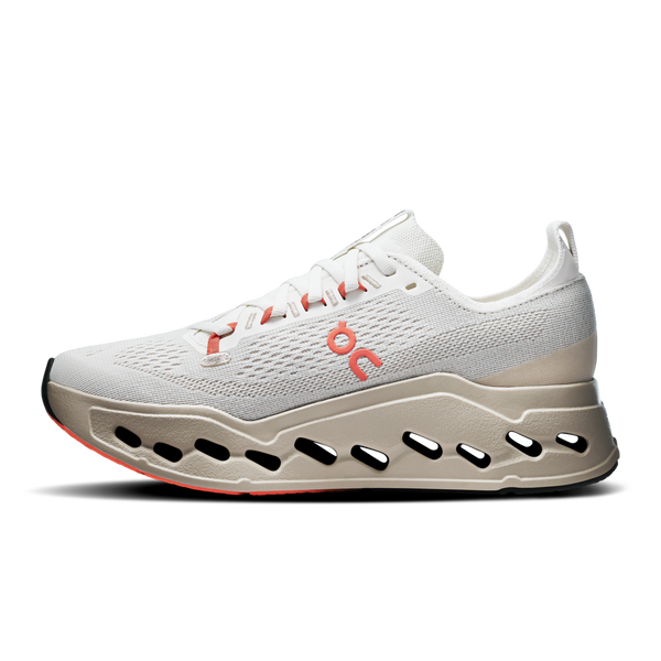 The medial side of a white running shoe with a unique sole design on a white background.