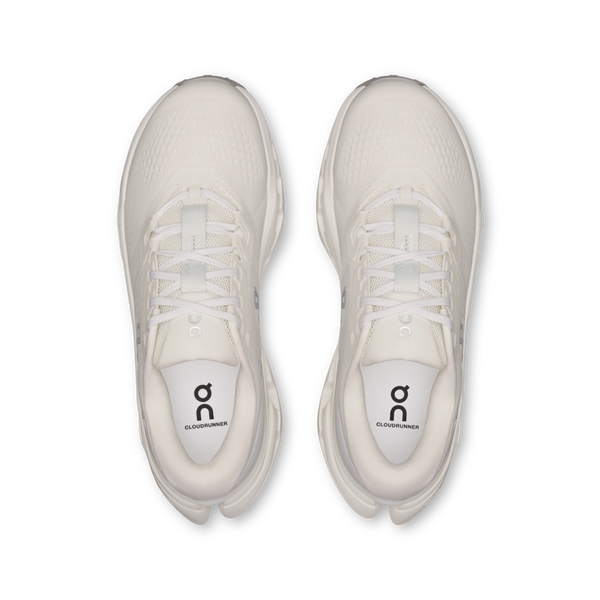 White running shoes with a visible brand logo on a white background