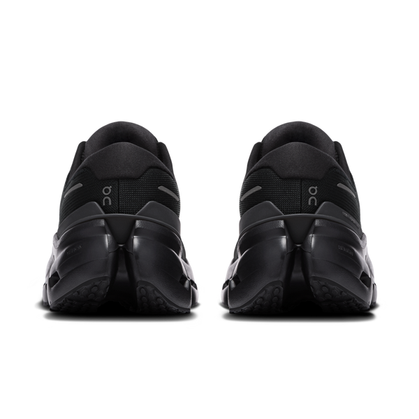 Black athletic shoes with a brand logo on a white background