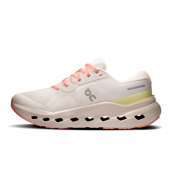 White running shoe with pink accents on a white background