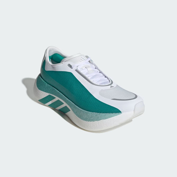 White and green sneaker with Adidas logo on a light gray background