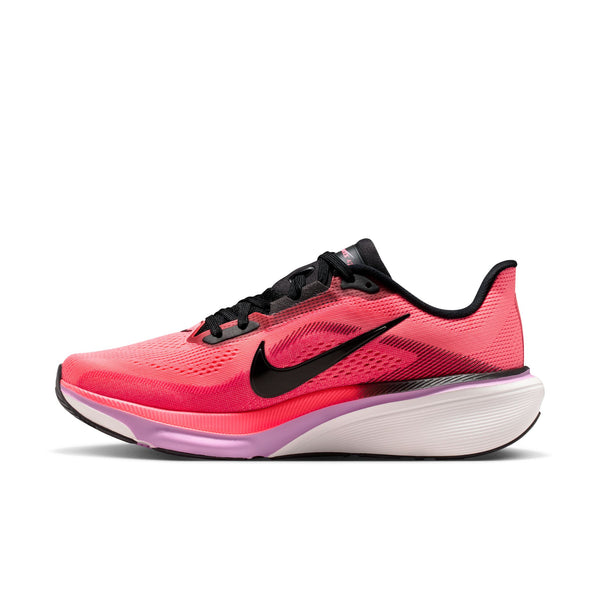 The medial side of a pink running shoe with black swoosh logo on a white background