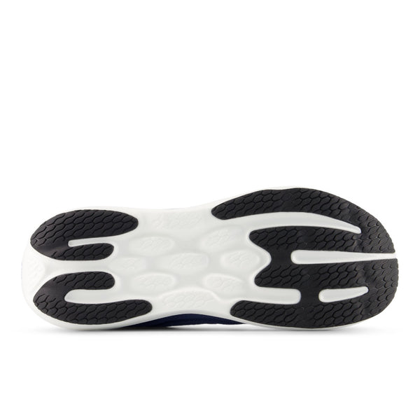 Close-up of a shoe sole with black and white pattern that promotes forward motion on a white background.
