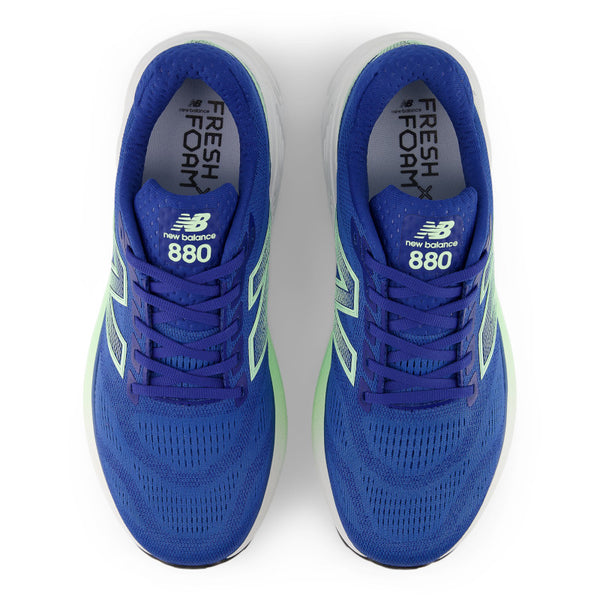 Blue New Balance 880 running shoes on a white background.