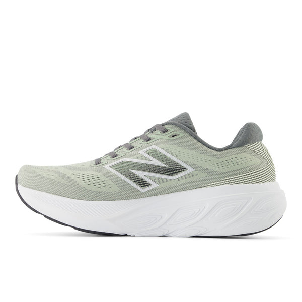 Green running shoe with New Balance logo on a white background.