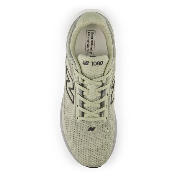 Green running shoe with white sole on a white background