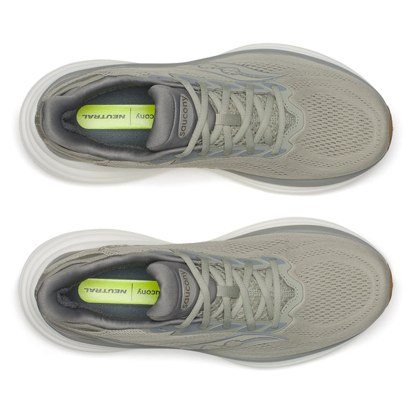 Pair of gray running shoes with a white sole on a white background