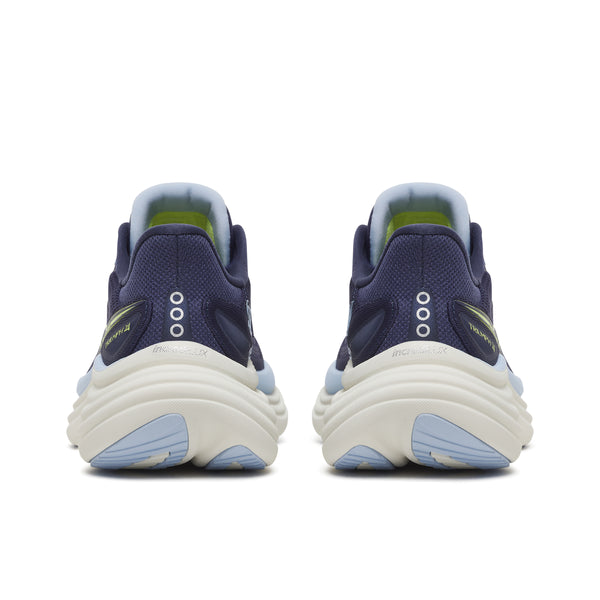 Navy running shoes with white soles on a white background