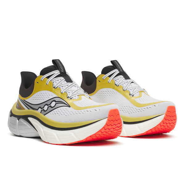 Pair of Saucony running shoes with white, yellow, and orange design on a white background