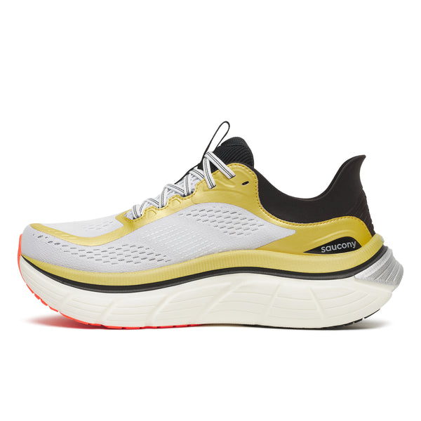 Saucony running shoe with yellow and black design on a white background