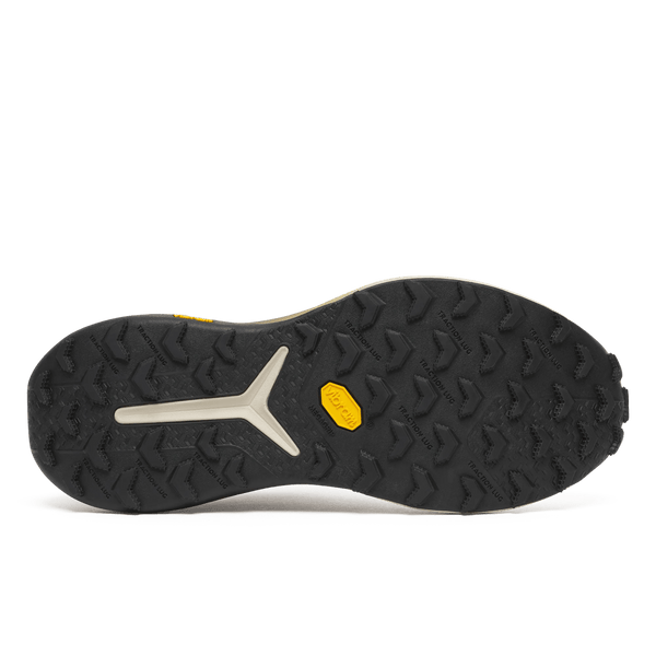 White and brown running shoe with visible branding on a white background