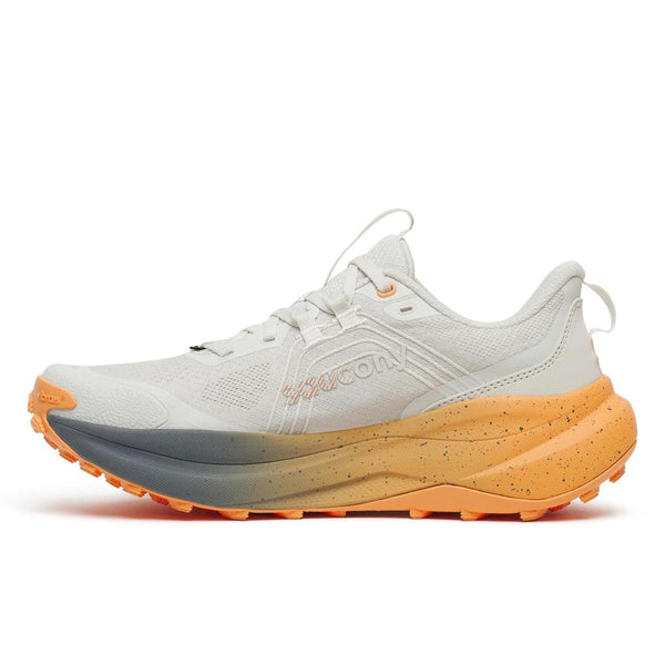 White running shoe with orange and gray sole on a white background