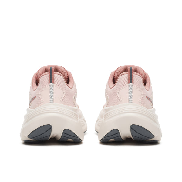 Pink running shoes with a white sole on a white background
