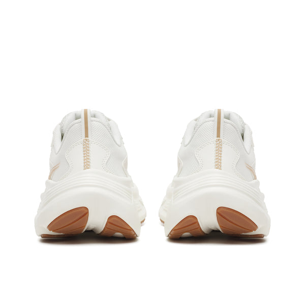 White sneakers with brown soles on a white background