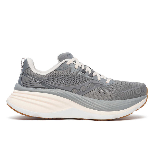A pair of women's running shoes with a gray upper, white midsole, and pink accents.