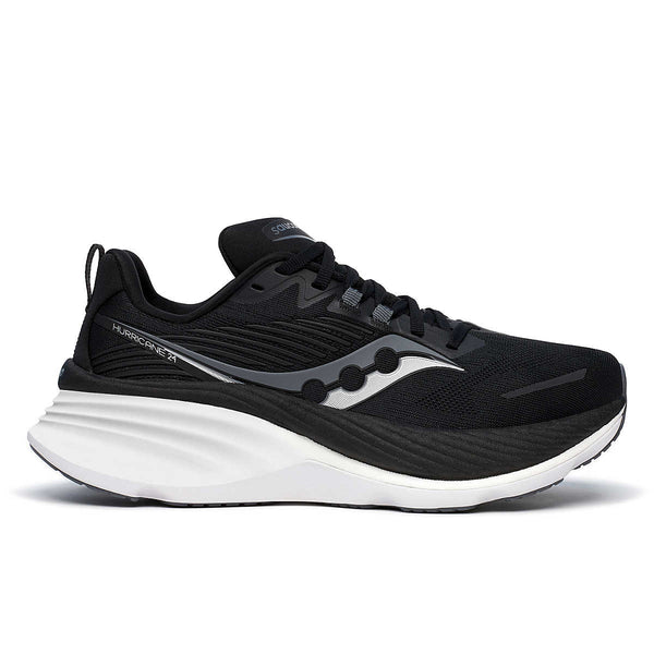 A pair of women's running shoes with a black upper and white sole, featuring the Saucony logo.