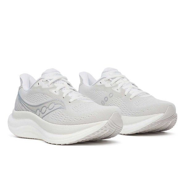 A pair of women's Saucony running shoes on a white background and white laces.