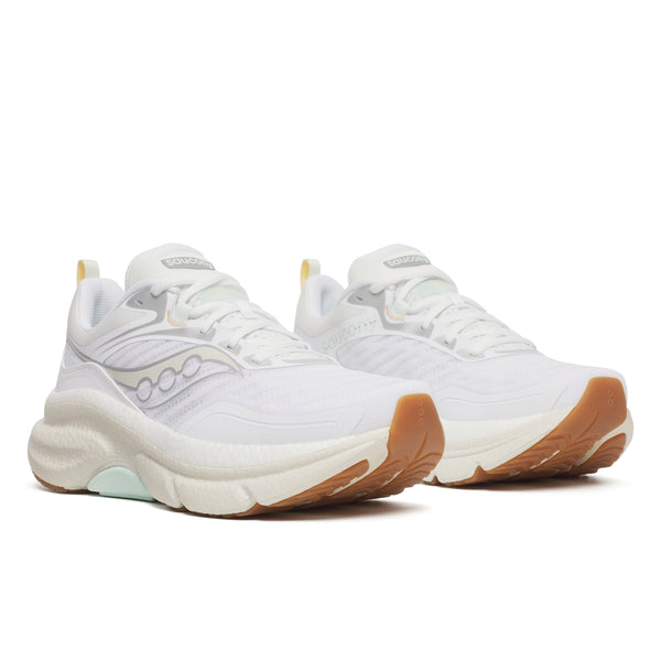White sneakers with brown soles on a white background