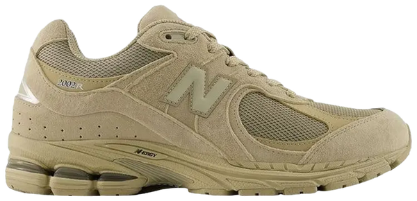 Beige running shoe with New Balance logo on a white background