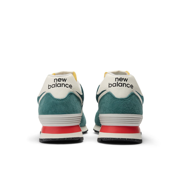 The back of the 574 has the words new balance on each shoe.