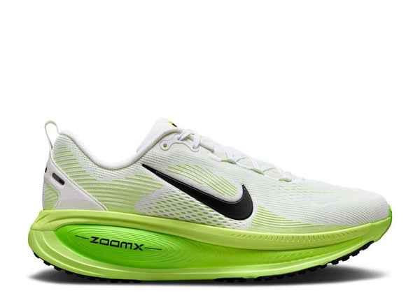 White and green running shoe with Nike logo on a white background.