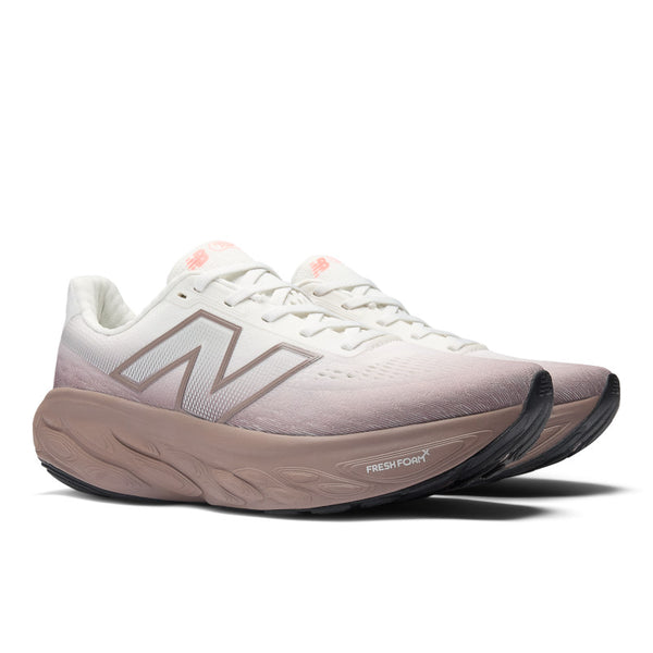 White and pink running shoe with 'Fresh Foam' text on a white background.