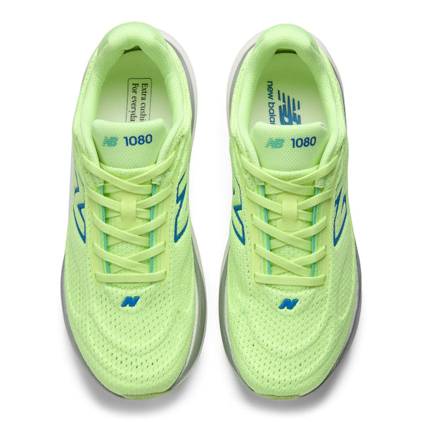 Pair of bright green running shoes with blue accents on a white background
